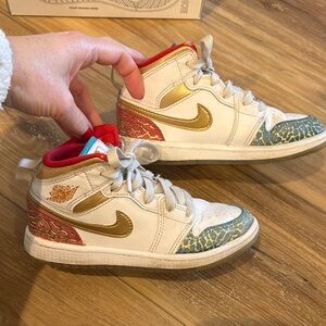 NIKE JORDAN 1 MID SS Metallic Gold,  White, Red, Blue High-Top Sneakers